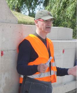Jeff McNeill guiding a battlefield walk at Mesen. Jeff is standing in front of the New Zealand Memorial to the Missing